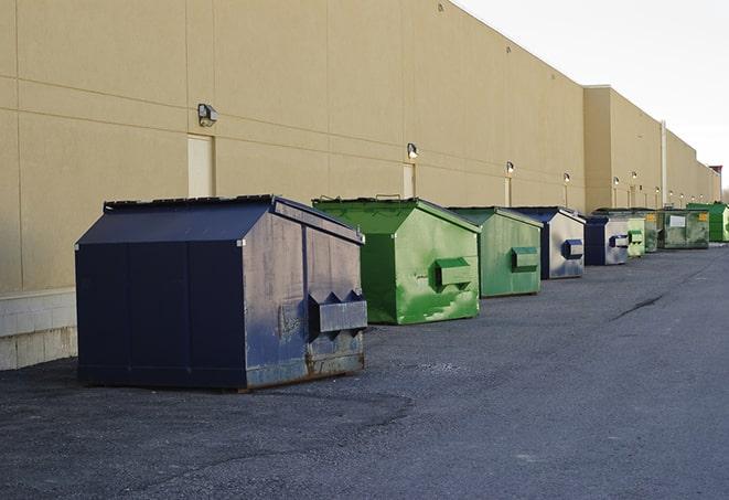 a group of construction workers taking a break near a dumpster in Cotter AR